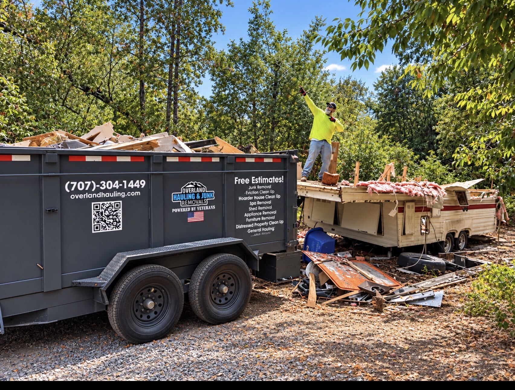 Overland Hauling & Junk Removal dumpster loaded with debris in Sonoma County - call 707-304-1449 for a free estimate